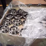 Automotive parts packaged with VCI Kraft Paper for enhanced protection
