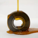 Gear coated with ZERUST Axxanol 46-Bio, bio-based rust preventative oil, showcasing corrosion protection and lubrication.