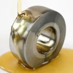 Applying ZERUST Axxanol 750-NV rust preventive oil on a bearing to provide up to 2 years of corrosion protection for various metals.