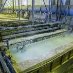 Acid pickling line using Acid Neutralizer to prevent flash corrosion on cleaned metals.