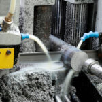 Close-up of cutting process using metalworking fluid additive for hard water treatment.