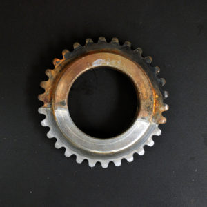 Half-submerged gear demonstrates Industrial Rust Remover's power