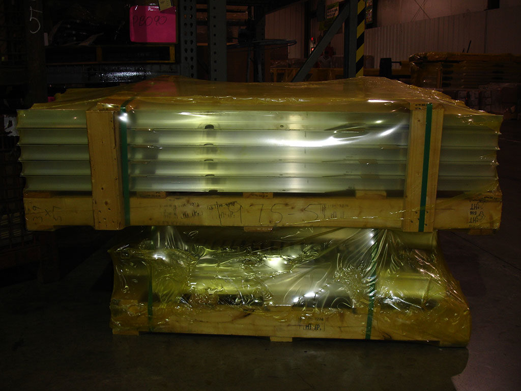 Materials on pallet wrapped in VCI shrink film for protection