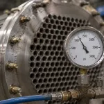 Pressure gauge on heat exchanger during hydrostatic testing with hydrostatic testing corrosion inhibitor