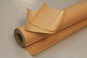 Roll and sheets of VCI Poly Kraft Paper for versatile packaging solutions