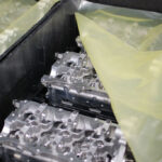 Engine components in dunnage covered with ZERUST Ferrous VCI sheeting