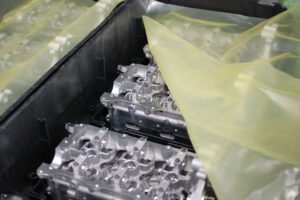 Engine components in dunnage covered with ZERUST Ferrous VCI sheeting
