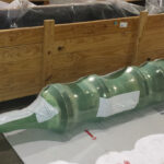 Large metal part shrink-wrapped with VCI shrink film for shipment