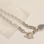 Silver necklace in poly bag demonstrating the effectiveness of anti-tarnish film.