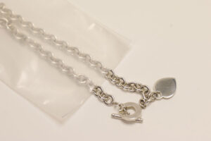 Silver necklace in poly bag demonstrating the effectiveness of anti-tarnish film.