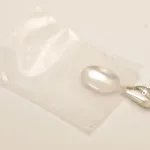 Silver jewelry secured in poly bag featuring ZERUST ICT520-CB1 Anti-Tarnish Film.