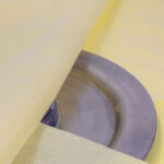 Close-up of VCI Plastic Scrim's woven strands on metal for added durability