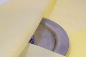 Close-up of VCI Plastic Scrim's woven strands on metal for added durability