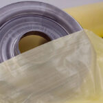Metal part on roll of VCI Plastic Scrim illustrating effective corrosion prevention