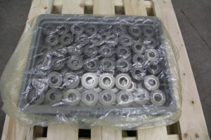Stacked bearings in tote covered by VCI tote covers for protection