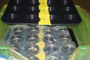 Returnable dunnage tray over packaged components with ZERUST ICT520-CSL.