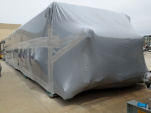 Large equipment wrapped in Outdoor VCI Shrink Film for long-term storage