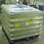 Automotive components on pallet wrapped in VCI stretch film for shipment