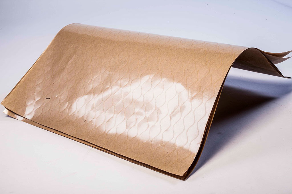 Sheet of ZERUST ICT420-35P VCI Poly Kraft Paper highlighting the protective poly side