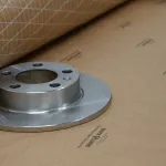 Brake rotor with Premium VCI Scrim Paper roll showcasing protection