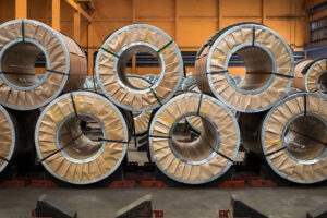 Metal coils securely wrapped in ZERUST ICT430-35SR VCI Scrim Paper.