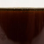 The raw form of ZERUST® Axxanol™ 710C VCI oil additive showcasing its purity before application.