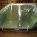 Car frames packaged in ZERUST VCI packaging, fogged with Axxatec 87-MB Water-Based Rust Inhibitor Liquid for rust prevention.