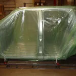 Car frames packaged in ZERUST VCI packaging, fogged with Axxatec 87-MB Water-Based Rust Inhibitor Liquid for rust prevention.