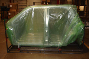 Car frames packaged in ZERUST VCI packaging, fogged with Axxatec 87-MB for rust prevention.