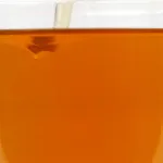 ZERUST® Axxanol™ 707C VCI oil additive being mixed with 5w-30 motor oil for enhanced corrosion protection.
