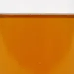 Raw liquid form of ZERUST Axxanol 707C VCI oil additive for corrosion protection.