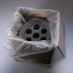 Metal part packaged in a box lined with ZERUST Natur-VCI, showcasing compostable VCI benefits.