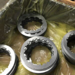 Metal components coated with ZERUST Axxanol A35CD-32 dry-to-touch rp, showcasing effective corrosion protection.