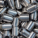 Small CNC-turned steel parts cleaned with industrial parts washer for optimal protection.