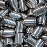 Small CNC-turned steel parts cleaned with industrial parts washer for optimal protection.