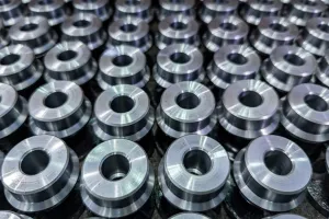 Batch of round steel parts cleaned with industrial parts washer for enhanced durability.