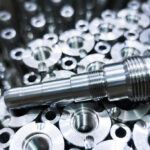 Close-up of steel rods cleaned with part cleaner for a precision finish.
