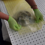 Brake rotor placed inside of ZERUST VCI Tubing, illustrating protective packaging.