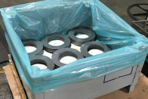 Metal components coated with ZERUST Axxanol A35CD-7 and packaged in ZERUST ICT VCI for enhanced corrosion resistance.