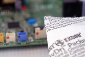 ActivDri PWA moisture control packet next to circuit board for corrosion protection