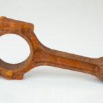 Rust-covered connecting rod before ZERUST AxxaClean ICT625-RR chelating rust remover treatment. Caption: See the extent of rust on this connecting rod before the ZERUST AxxaClean treatment