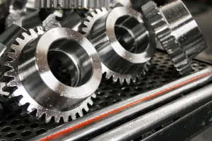 Gear wheels cleaned with hard water compatible parts cleaner for industrial use.