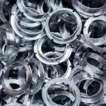 Machined metal parts protected with water-based aluminum rust preventative for corrosion resistance.