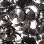 Overhead view of milled parts coated with water-based aluminum rust preventative.