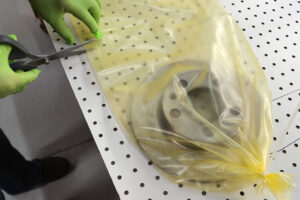 Brake rotor packaged in VCI poly tubing made from ZERUST ICT510-PCR30 VCI Film, demonstrating advanced corrosion protection.