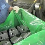 Manufacturing employee transporting stamped parts in ZERUST VCI Film