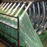 Stamped automotive frames wrapped in ZERUST ICT520-FD Flame Retardant VCI Film