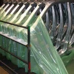 Stamped automotive frames wrapped in ZERUST ICT520-FD Flame Retardant VCI Film