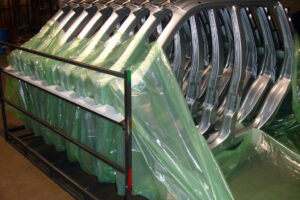 Stamped automotive frames wrapped in ZERUST ICT520-FD Flame Retardant VCI Film