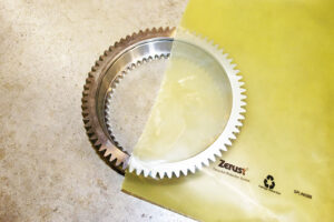Protective packaging for a large gear demonstrating ZERUST technology.